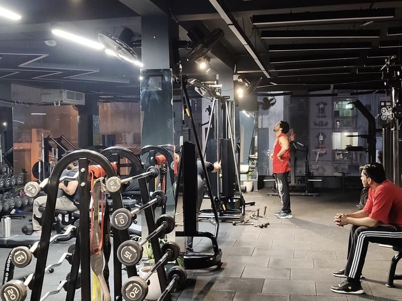 Dumbbell racks and cable machines on the strength floor